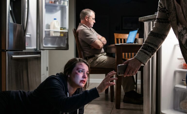 My husband shoved me against the refrigerator, then kicked me so hard with his knee that my nose broke. I was bleeding, trembling, and reached for my phone—until my mother-in-law snatched it away. “Just a small scratch,” she snapped. And my father-in-law? “Drama queen,” he muttered. They had no idea what I was going to do next.